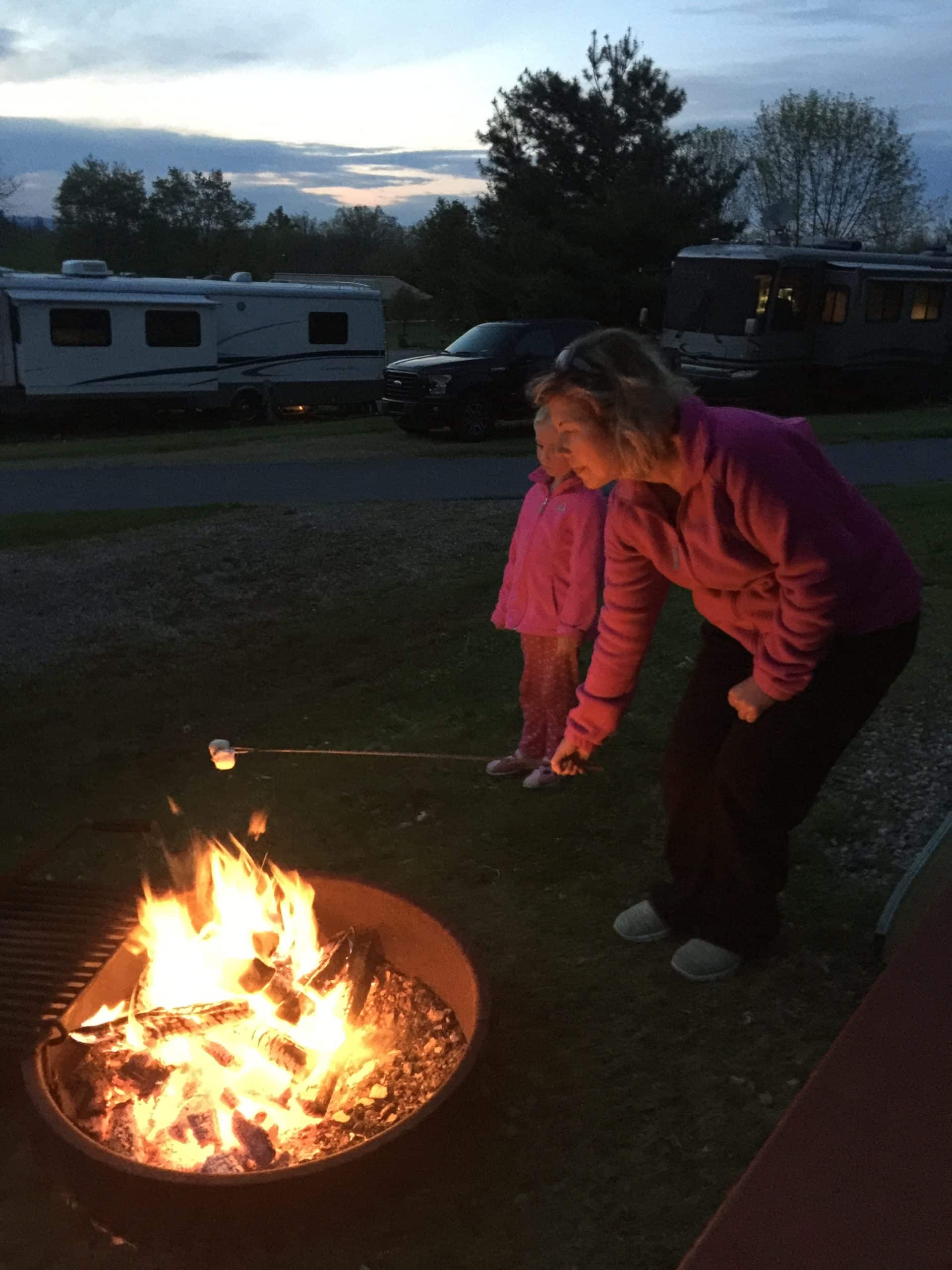 Woman And Girl Roasting Marshmallows Camping RV Travel Guide