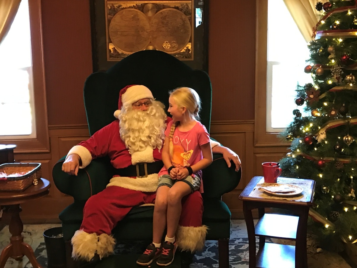 Girl Visits Santa Santa's Village Jefferson New Hampshire Christmas Theme Parks