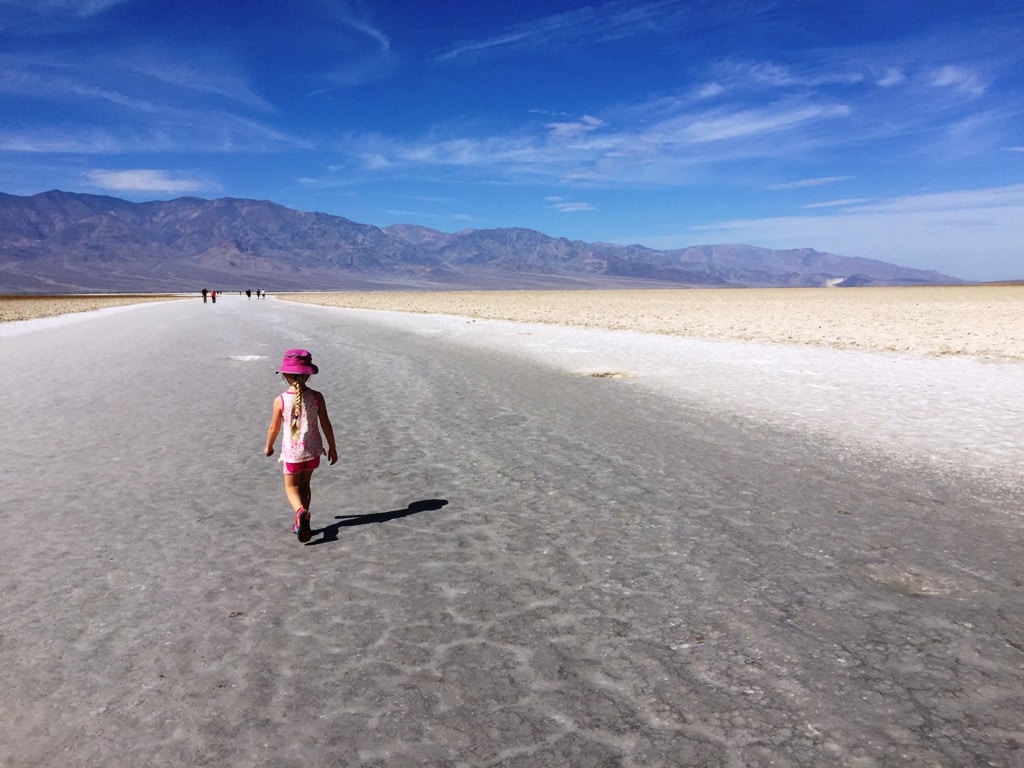Girl In Badwater Basin Of The Badlands Best National Parks To Visit In Winter