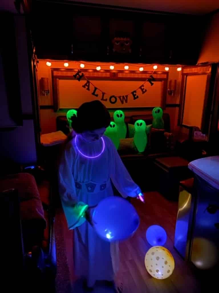 RV Halloween Camping Activities Glow Dance Party With Girl In Costume