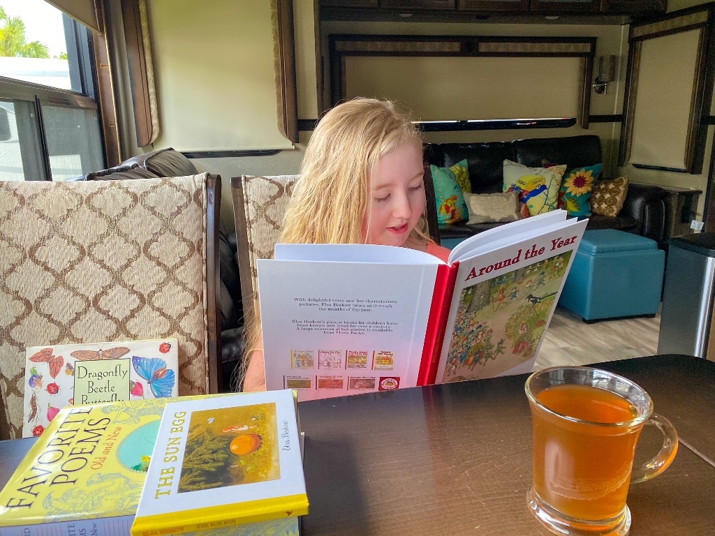 Girl Reading Books In RV How To Find Life Balance RV Living Full Time
