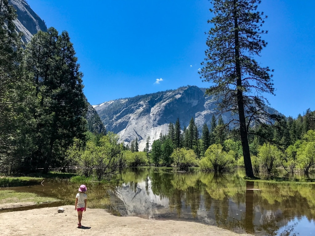 Girl Standing By Mirror Lake Reservations For Entrance To Yosemite National Park