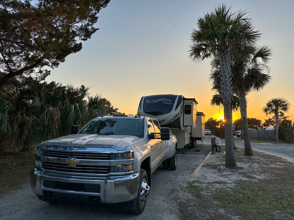 RV with palm trees and sunset - best RV to live in