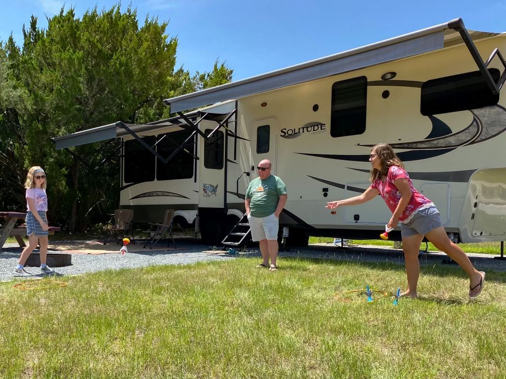 Family Playing Yard Games In Florida State Park - Hacks To Book State Park Reservations Florida