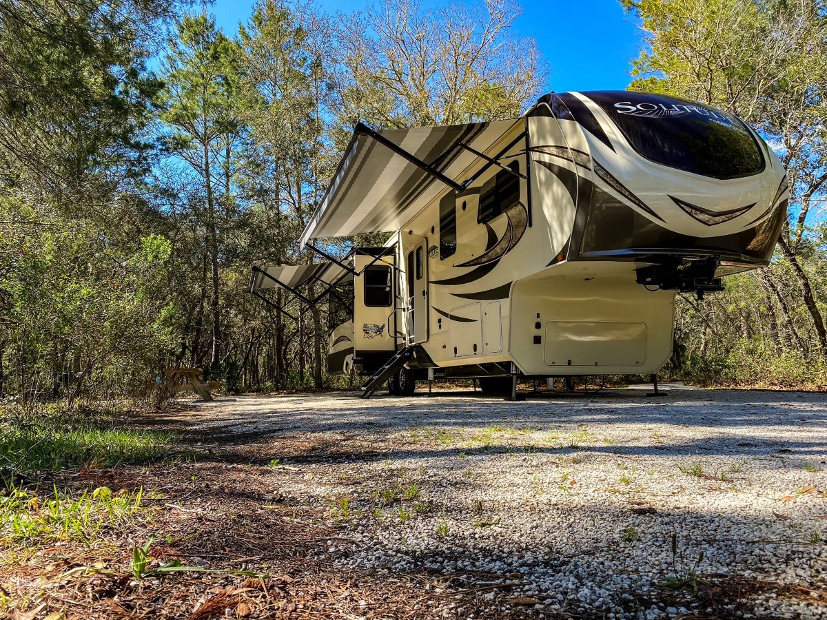 RV In A Florida State Park Campsite - Florida State Park Camping Guide and Hacks To Book State Park Reservations Florida