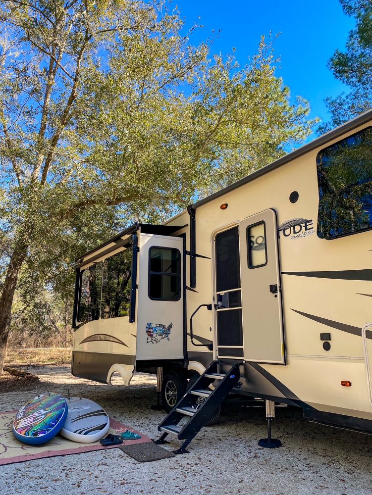 RV in state park with paddle boards - RV full time