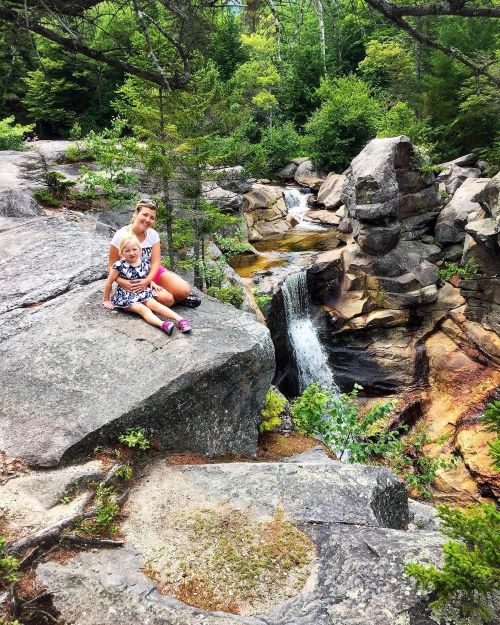 Mom and daughter at waterfall in Maine on RV trip