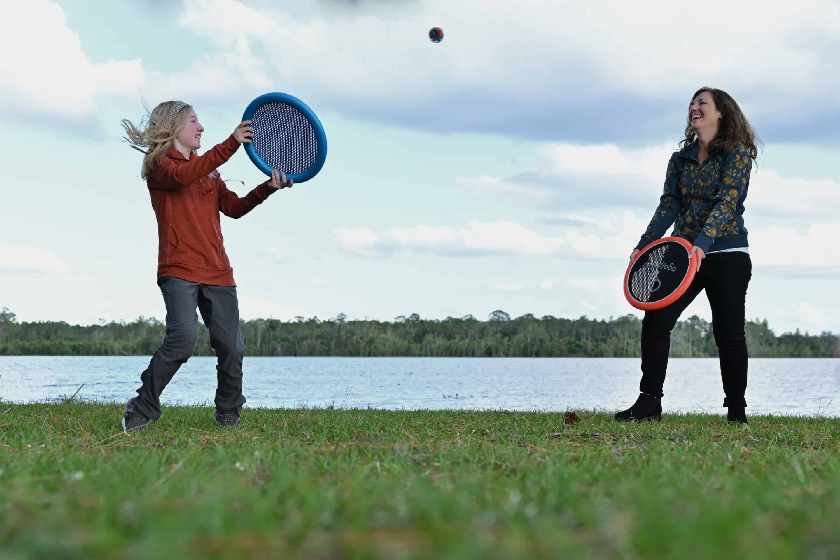 Family playing catch while RVing - AI RV trip planner AdventureGenie